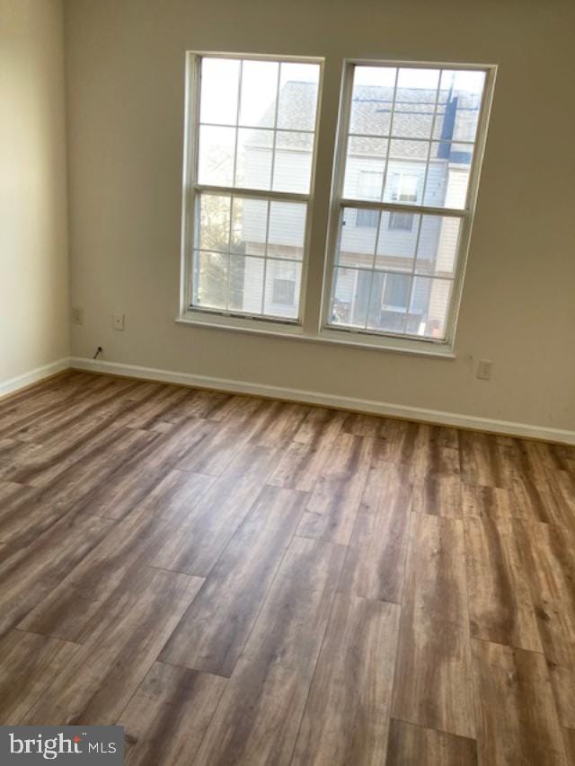 empty room featuring wood-type flooring