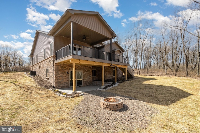 107 S Honeysuckle Dr, Hazle Township, PA 18202 - back of property featuring a fire pit, a patio, stairway, a wooden deck, and a ceiling fan