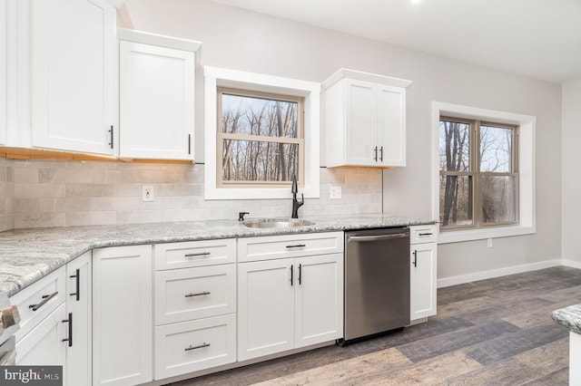 107 S Honeysuckle Dr, Hazle Township, PA 18202 - kitchen with stainless steel dishwasher, white cabinets, dark wood-type flooring, backsplash, and light stone counters