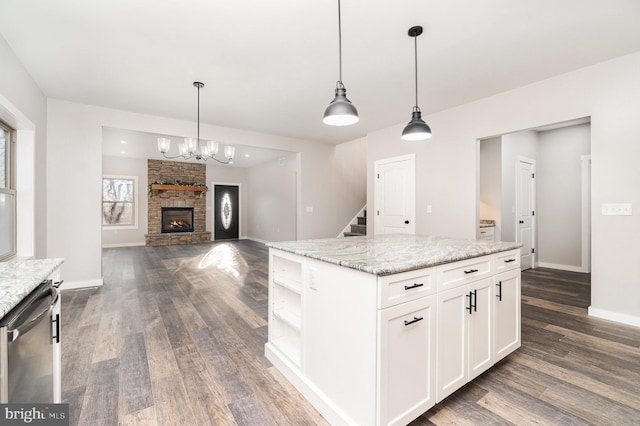107 S Honeysuckle Dr, Hazle Township, PA 18202 - kitchen with stainless steel dishwasher, dark wood-style flooring, a chandelier, white cabinetry, and a center island