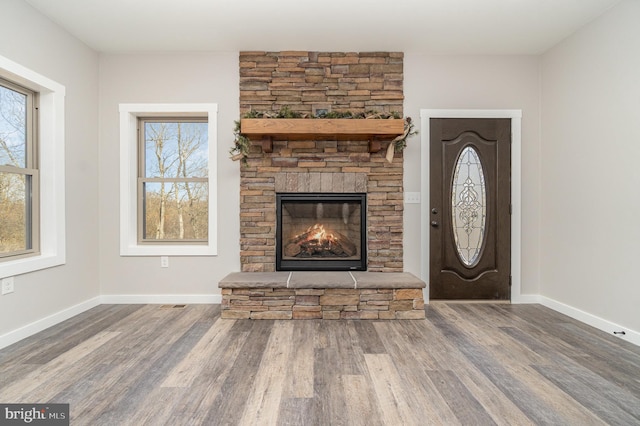 107 S Honeysuckle Dr, Hazle Township, PA 18202 - entrance foyer featuring a fireplace and wood finished floors