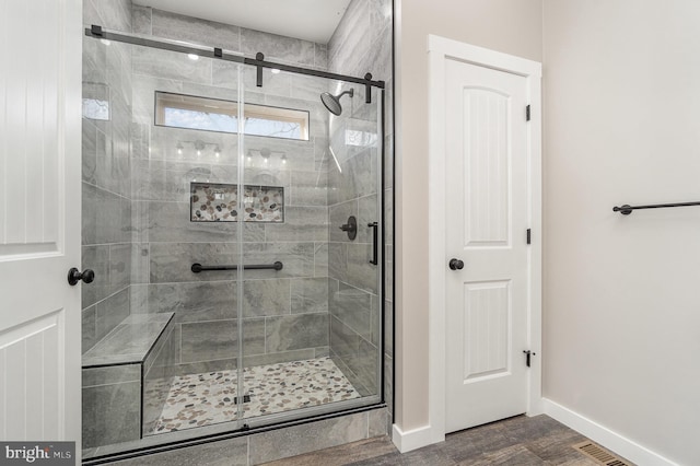 107 S Honeysuckle Dr, Hazle Township, PA 18202 - full bath featuring a shower stall and wood finished floors