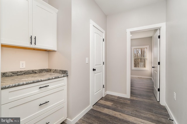 107 S Honeysuckle Dr, Hazle Township, PA 18202 - corridor with dark wood-style flooring and baseboards