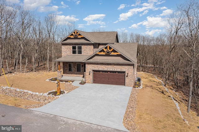 107 S Honeysuckle Dr, Hazle Township, PA 18202 - craftsman-style house featuring stone siding, concrete driveway, roof with shingles, and a garage
