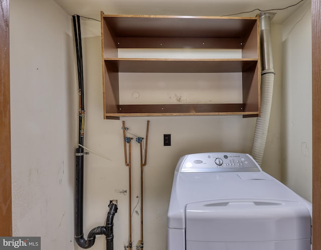 clothes washing area featuring washer / dryer