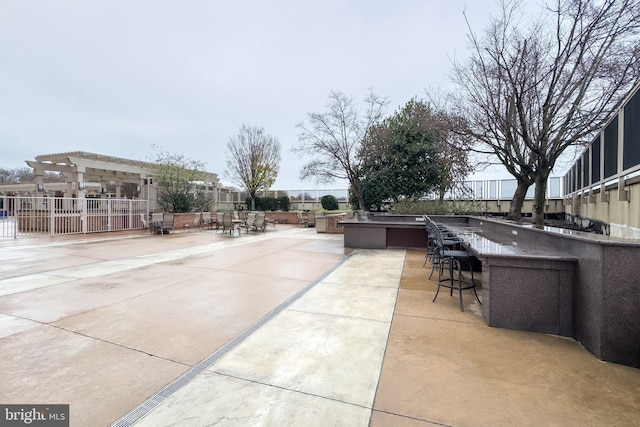 view of patio with an outdoor bar