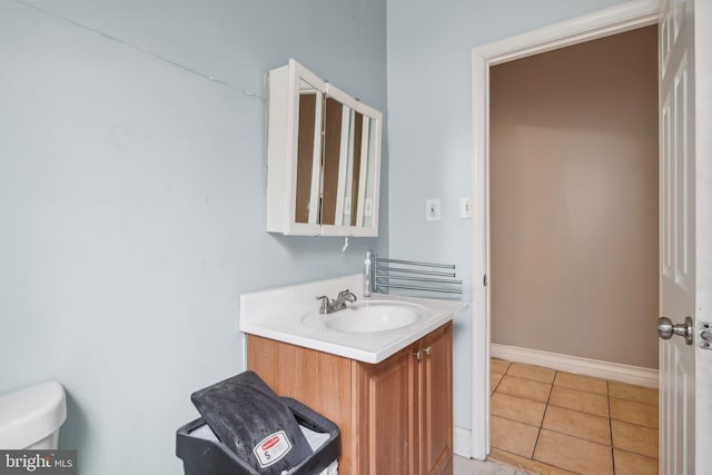 bathroom with tile patterned floors, toilet, and vanity