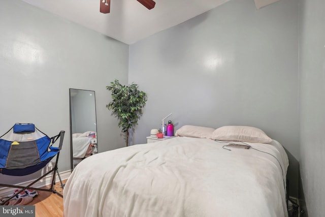 bedroom featuring wood-type flooring and ceiling fan