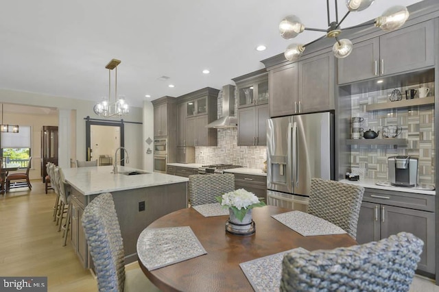 dining area with light hardwood / wood-style floors and sink