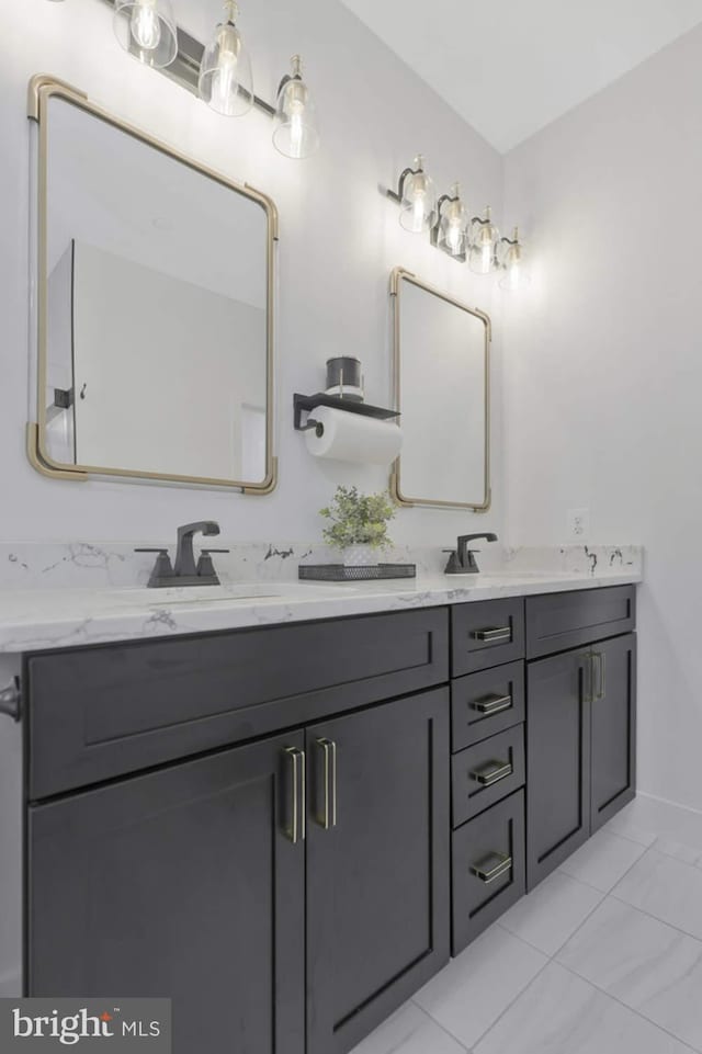 bathroom featuring tile patterned floors and vanity