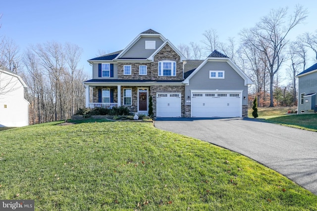 craftsman-style house with covered porch and a front lawn