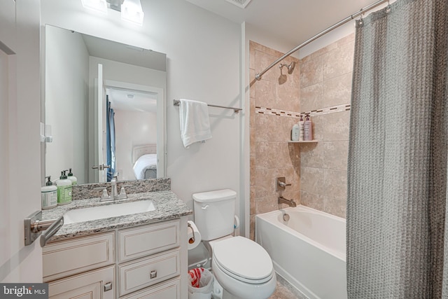 full bathroom featuring vanity, shower / tub combo, and toilet