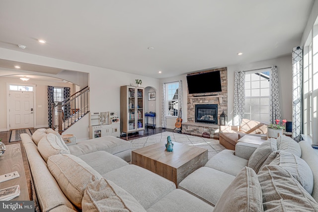 living room with a stone fireplace