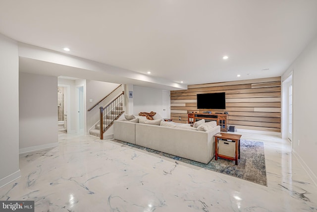 living room with wood walls