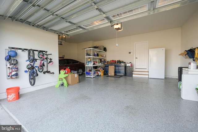 garage with white fridge and a garage door opener