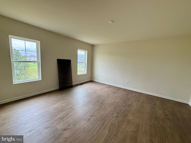 unfurnished living room featuring hardwood / wood-style floors