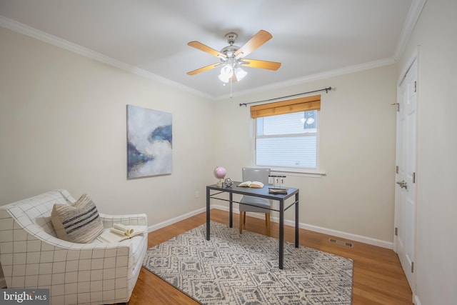 office area featuring hardwood / wood-style flooring, ceiling fan, and ornamental molding