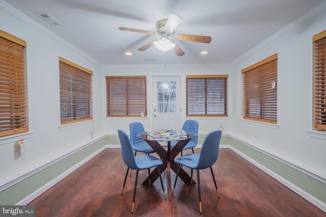 dining area featuring dark hardwood / wood-style flooring, ceiling fan, and ornamental molding