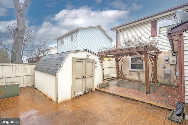 view of outbuilding with a pergola