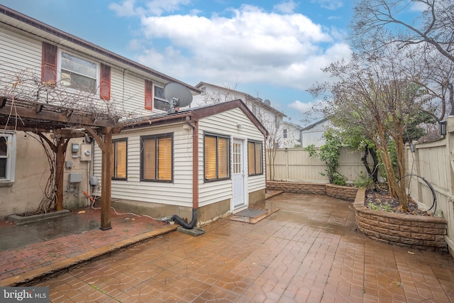 back of property featuring a patio