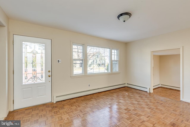 entryway featuring light parquet flooring and a baseboard heating unit