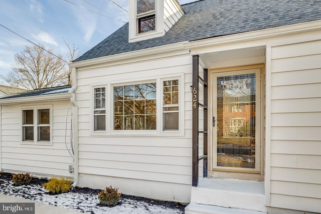 view of snow covered property entrance