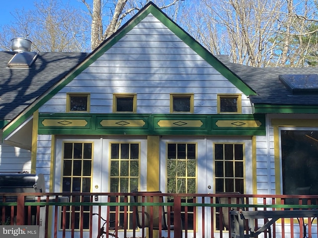 rear view of house featuring french doors