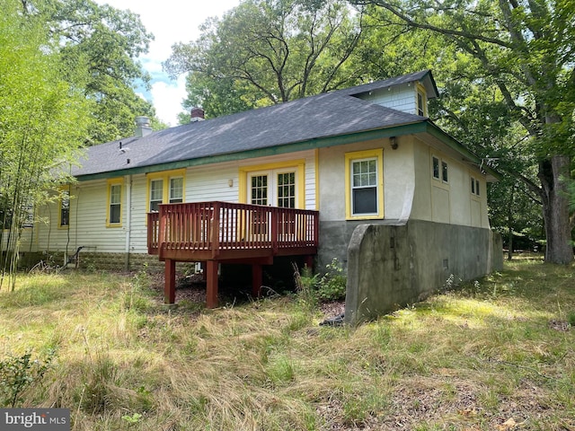 back of property with a deck