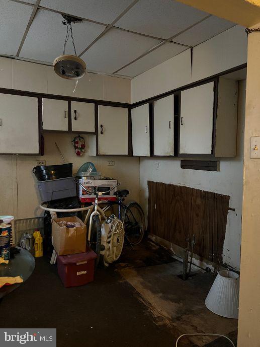 basement featuring a drop ceiling