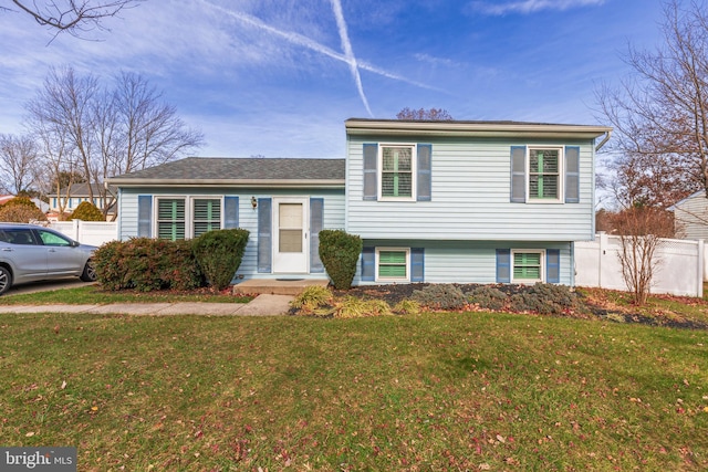 split level home with a front lawn