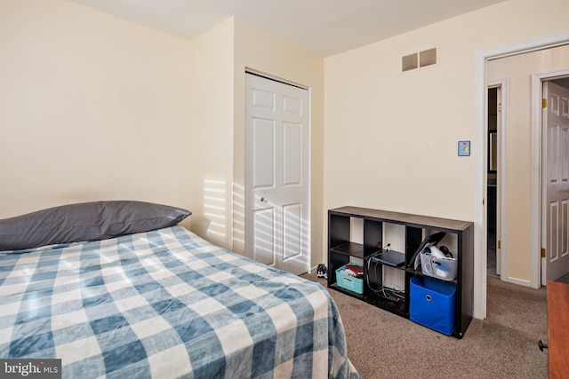 carpeted bedroom featuring a closet