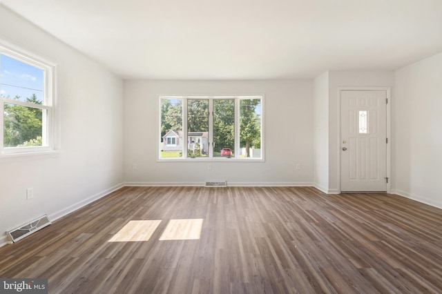 interior space with dark hardwood / wood-style flooring