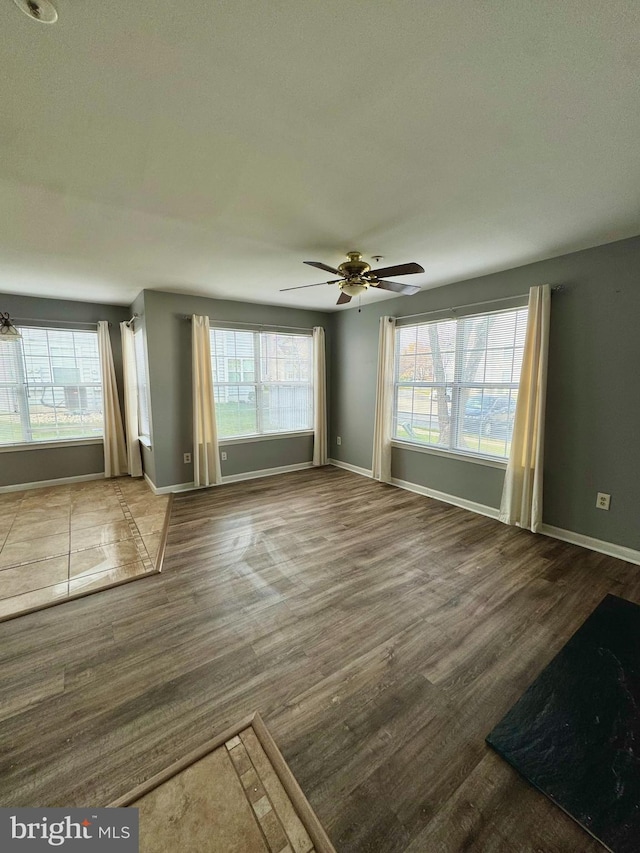 interior space featuring ceiling fan and hardwood / wood-style flooring