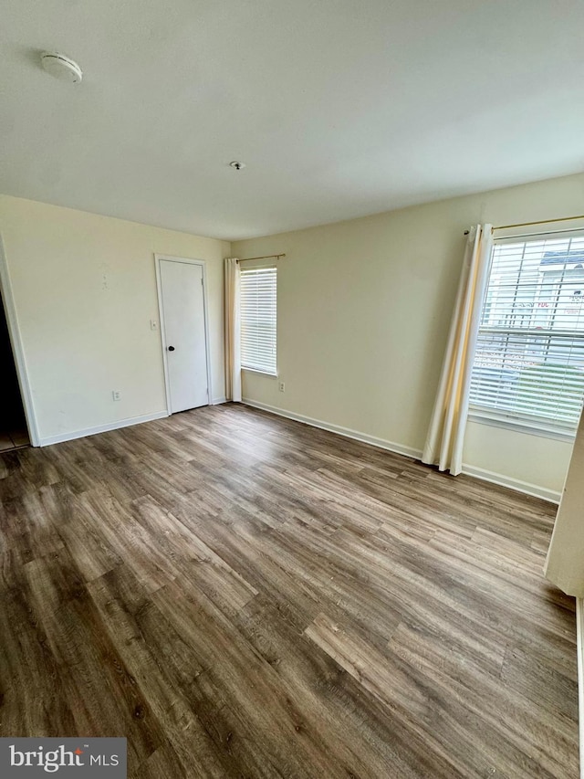 spare room with hardwood / wood-style flooring