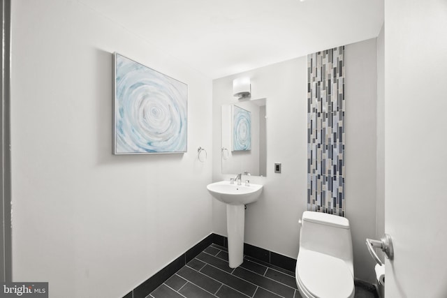 bathroom featuring tile patterned floors and toilet