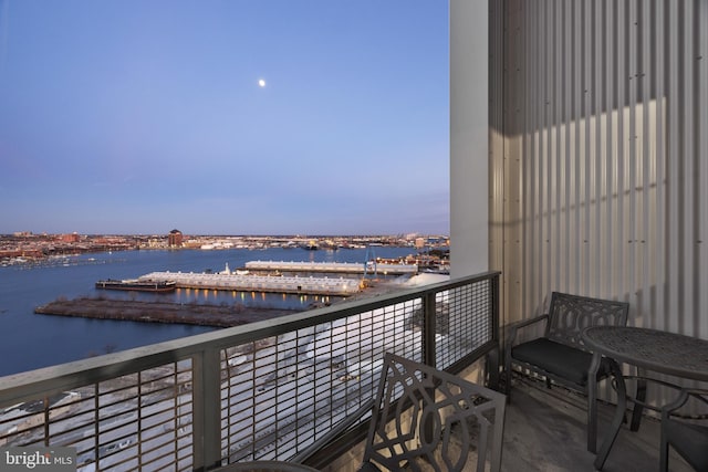 balcony at dusk with a water view