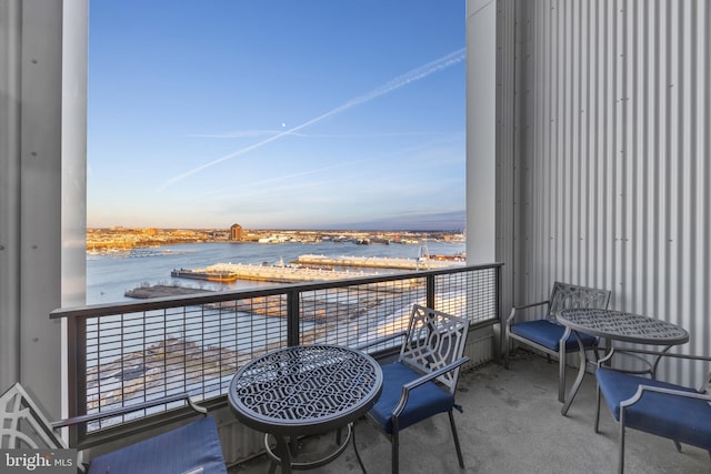 balcony featuring a water view