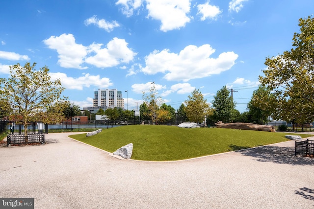 view of home's community featuring a lawn