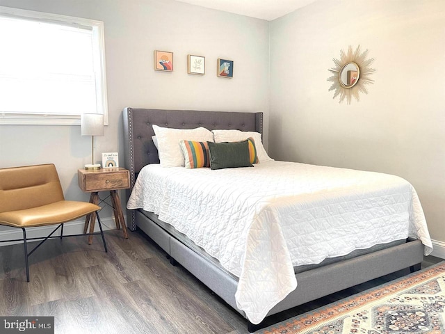 bedroom with wood-type flooring