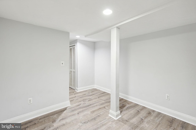 basement featuring light hardwood / wood-style flooring