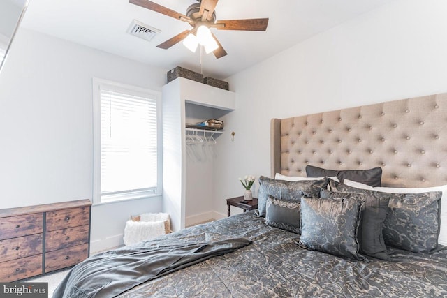 bedroom featuring ceiling fan and a closet