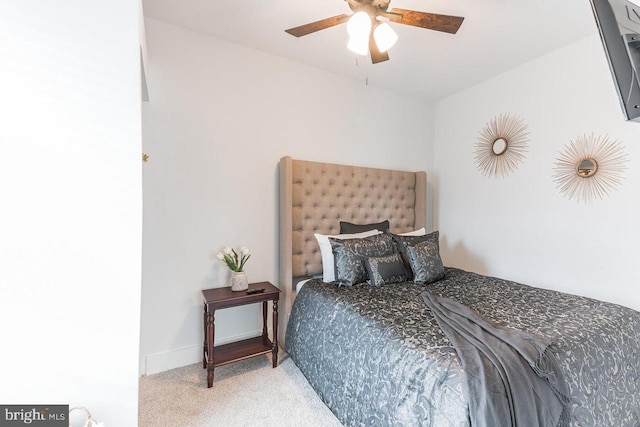 bedroom with ceiling fan and light colored carpet