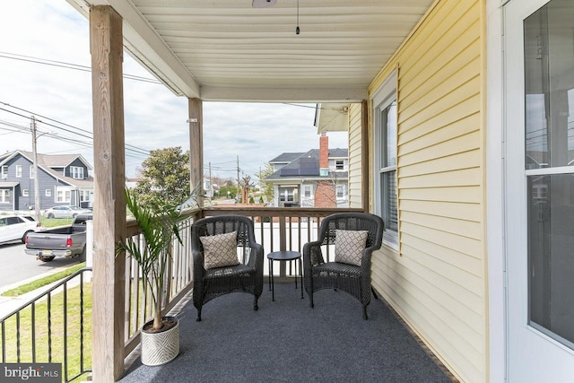 balcony featuring a porch