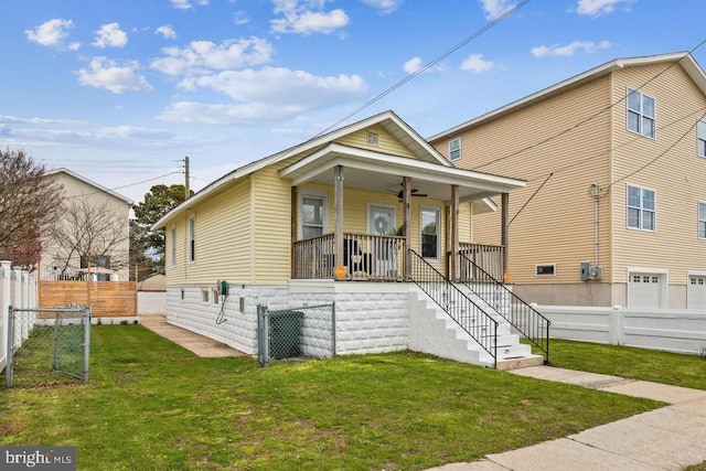 view of front of house with a front yard and a porch