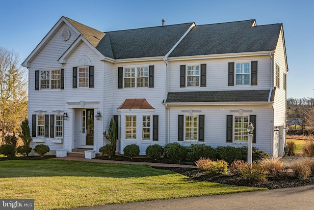 view of front of property with a front lawn