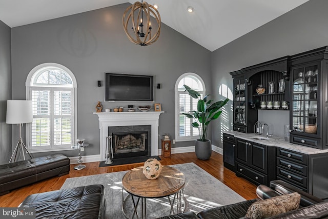 living room with dark wood-type flooring and a wealth of natural light