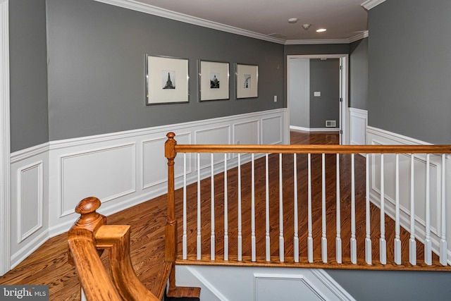 stairway featuring ornamental molding