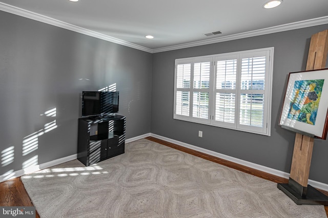 miscellaneous room with light wood-type flooring and ornamental molding