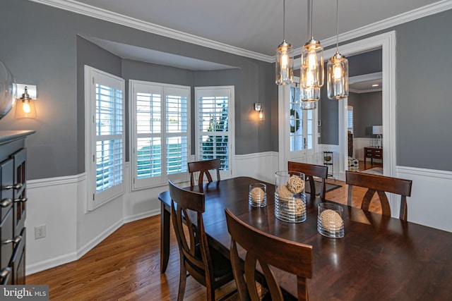 dining area featuring crown molding and wood-type flooring