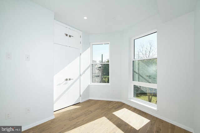 spare room featuring light hardwood / wood-style flooring